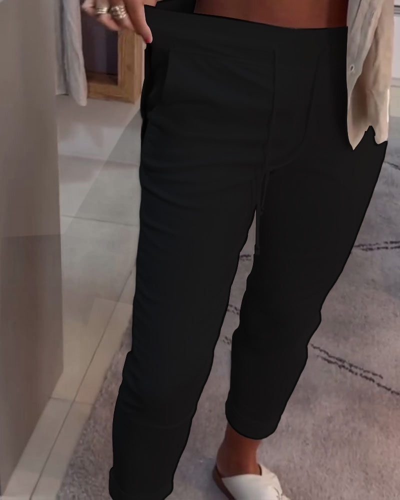 Nahia – Soepelvallende broek met trekkoord, elastische taille, relaxte rechte pasvorm