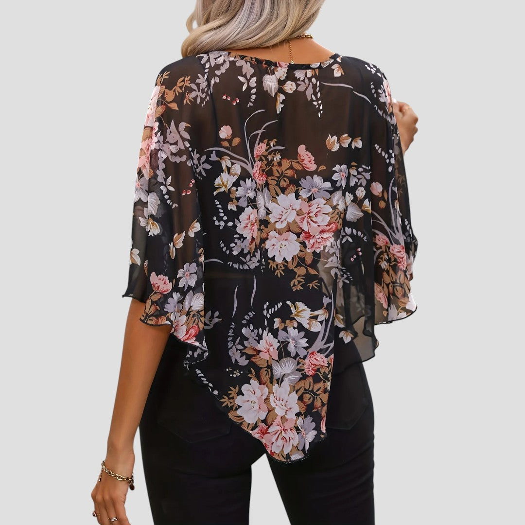Chiara – Elegante asymmetrische blouse met ronde hals en bloemenprint