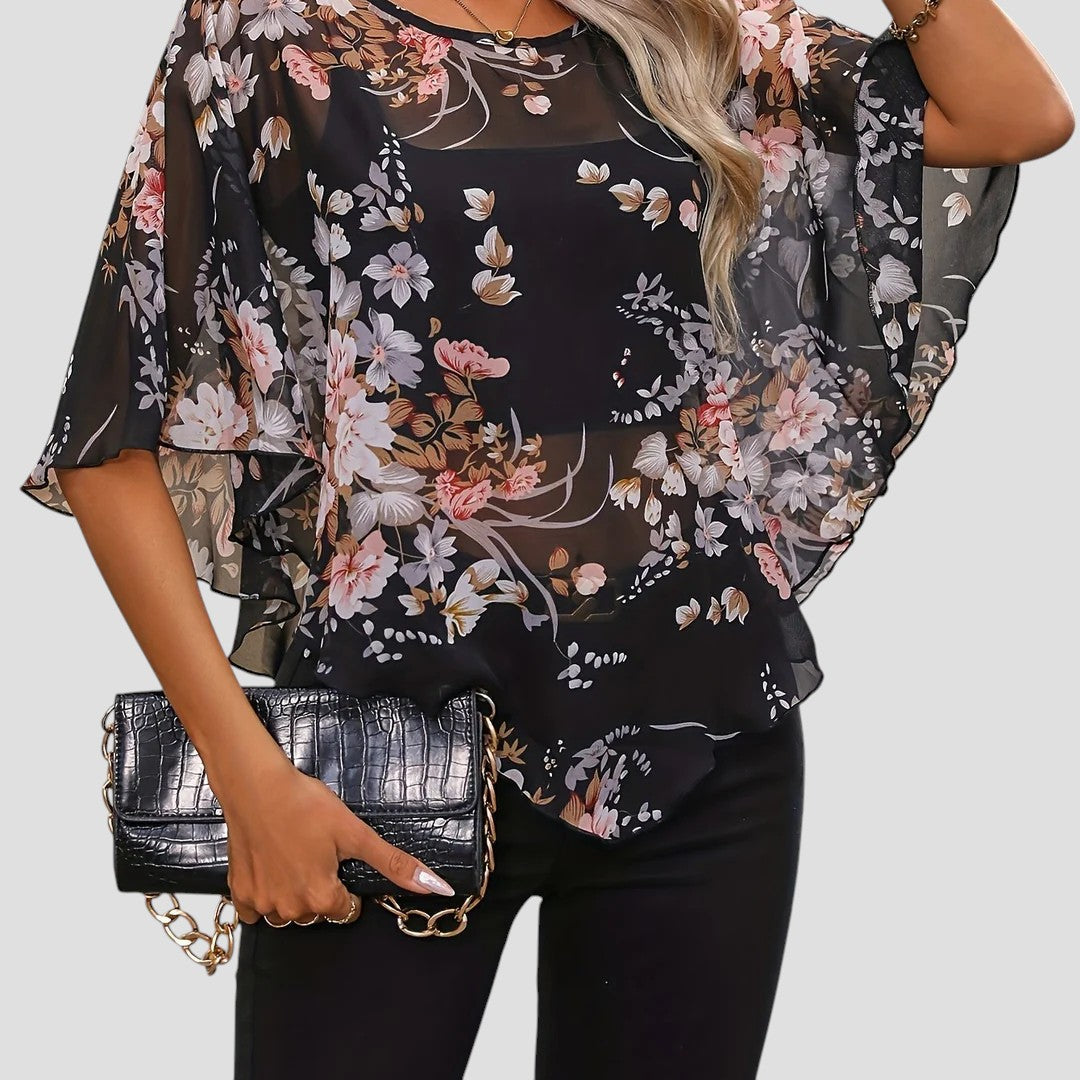 Chiara – Elegante asymmetrische blouse met ronde hals en bloemenprint