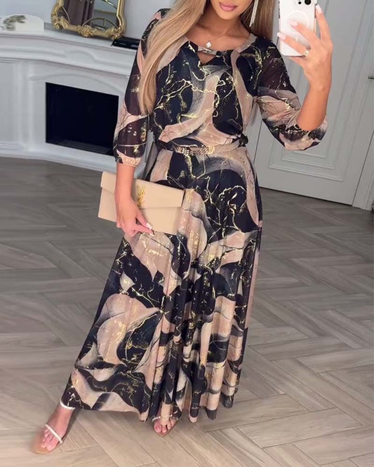 Oria – Elegante printjurk met 3/4 mouwen en getailleerde taille