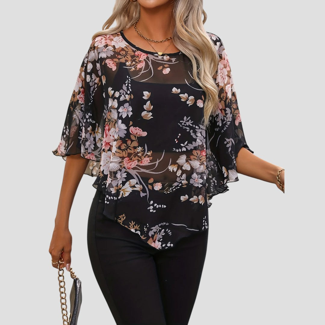 Chiara – Elegante asymmetrische blouse met ronde hals en bloemenprint