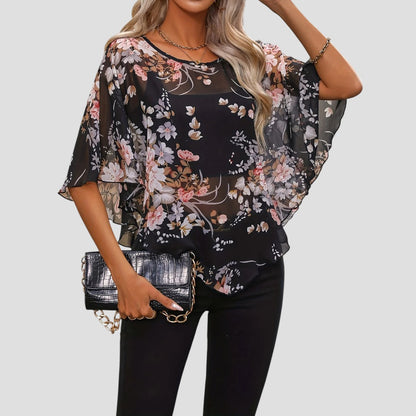 Chiara – Elegante asymmetrische blouse met ronde hals en bloemenprint