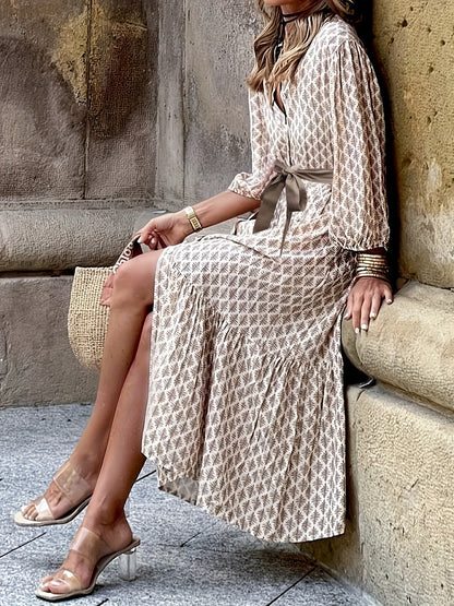 Daganna | Elegante jurk met knoopjes en strikdetail