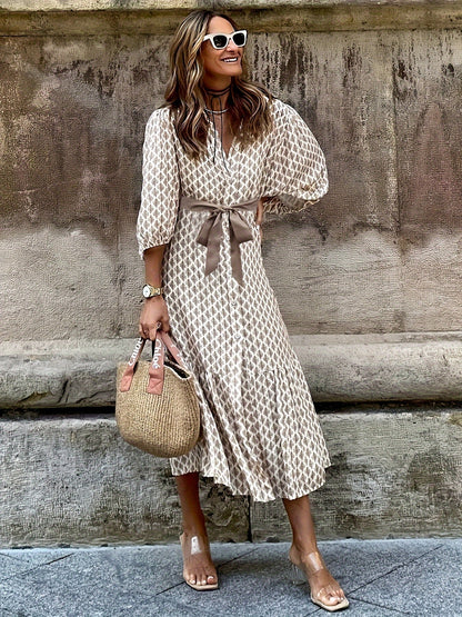 Daganna | Elegante jurk met knoopjes en strikdetail