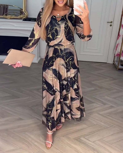 Oria – Elegante printjurk met 3/4 mouwen en getailleerde taille