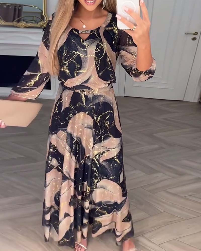 Oria – Elegante printjurk met 3/4 mouwen en getailleerde taille